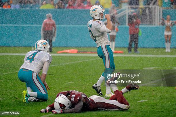 Andrew Franks of the Miami Dolphins celebrates after kicking the game winning field goal against the Arizona Cardinals at Hard Rock Stadium on...