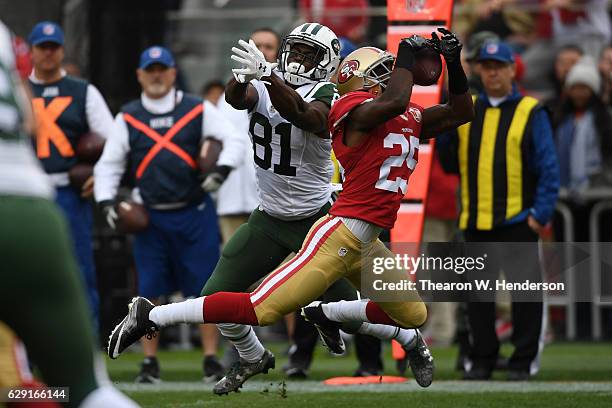 Jimmie Ward of the San Francisco 49ers intercepts a pass intended for Quincy Enunwa of the New York Jets in the first quarter of their NFL game at...