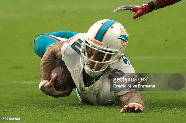 Kenny Stills of the Miami Dolphins makes a catch during a game against the Arizona Cardinals at Hard Rock Stadium on December 11, 2016 in Miami...