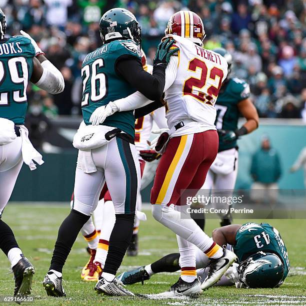 Jaylen Watkins of the Philadelphia Eagles and Deshazor Everett of the Washington Redskins look on as Darren Sproles of the Philadelphia Eagles is...