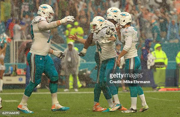 Andrew Franks of the Miami Dolphins celebrates a game winning field goal during a game against the Arizona Cardinals at Hard Rock Stadium on December...