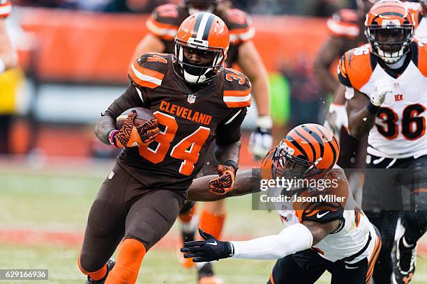 Wide receiver Jordan Payton of the Cleveland Browns breaks past free safety George Iloka of the Cincinnati Bengals during the second half at...