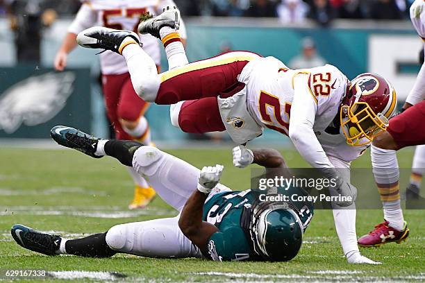 Deshazor Everett of the Washington Redskins lays out Darren Sproles of the Philadelphia Eagles on a kickoff return during the fourth quarter at...