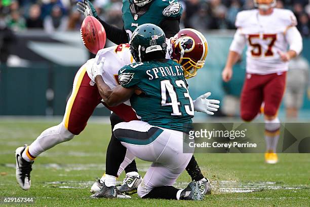 Deshazor Everett of the Washington Redskins lays out Darren Sproles of the Philadelphia Eagles on a kickoff return during the fourth quarter at...