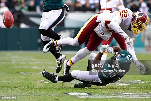 Deshazor Everett of the Washington Redskins lays out Darren Sproles of the Philadelphia Eagles on a kickoff return during the fourth quarter at...