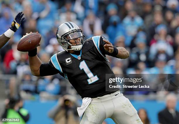 Cam Newton of the Carolina Panthers throws a pass against the San Diego Chargers in the 3rd quarter during their game at Bank of America Stadium on...