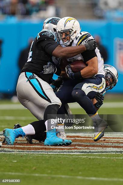 San Diego Chargers running back Kenneth Farrow is stopped by Carolina Panthers outside linebacker Shaq Green-Thompson during the second half between...