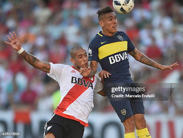 Ricardo Centurion of Boca Juniors heads the ball and score the fourth goal of his team during a match between River Plate and Boca Juniors as part of...