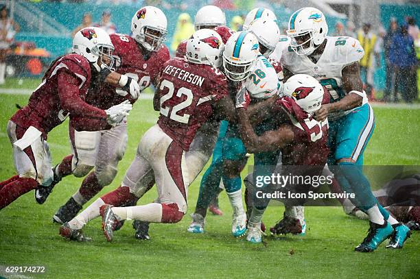 Miami Dolphins Running Back Damien Williams runs with ball and is tackled by Arizona Cardinals Linebacker Chandler Jones , Arizona Cardinals...