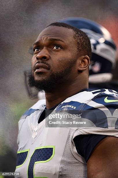 Cliff Avril of the Seattle Seahawks watches action during a game against the Green Bay Packers at Lambeau Field on December 11, 2016 in Green Bay,...