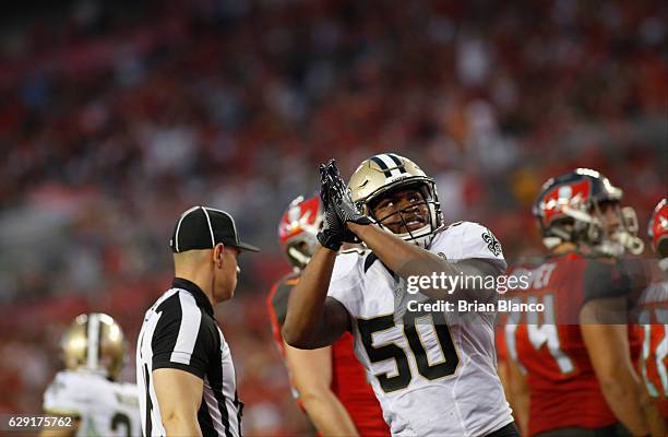 Outside linebacker Stephone Anthony of the New Orleans Saints celebrates after running back Doug Martin of the Tampa Bay Buccaneers is stopped for a...