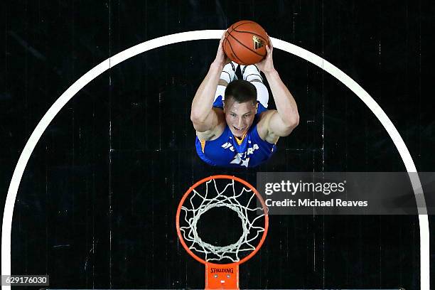 Rokas Gustys of the Hofstra Pride goes up for a dunk against the Kentucky Wildcats in the first half of the Brooklyn Hoops Winter Festival at...