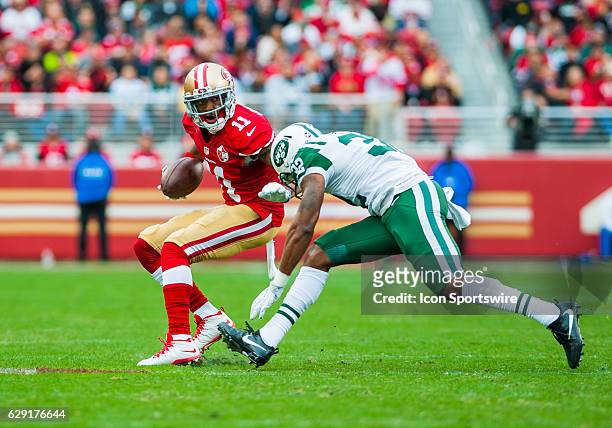 San Francisco 49ers wide receiver Quinton Patton looks to pass by a New York Jets player during the regular season NFL game between the San Francisco...