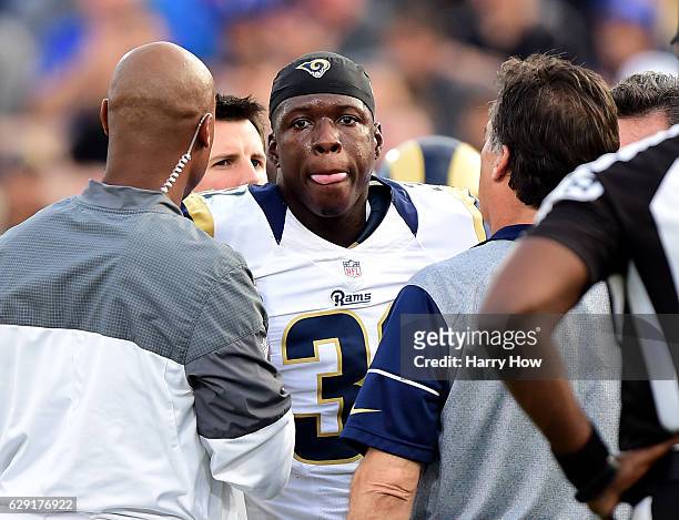 Maurice Alexander of the Los Angeles Rams reacts as he stands up after a collision with Nick Williams of the Atlanta Falcons at Los Angeles Memorial...
