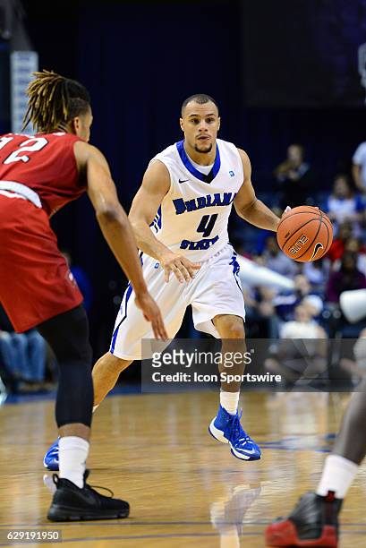 Indiana State Sycamores Guard Brenton Scott brings the ball up the court during the game between the Western Kentucky Hilltoppers and the Indiana...