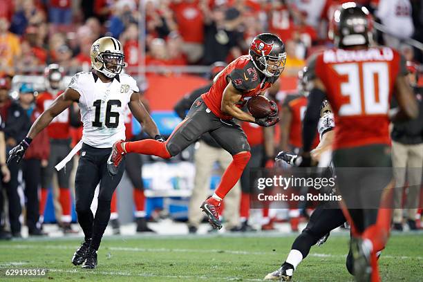 Brent Grimes of the Tampa Bay Buccaneers intercepts a pass in the fourth quarter of the game against the New Orleans Saints at Raymond James Stadium...