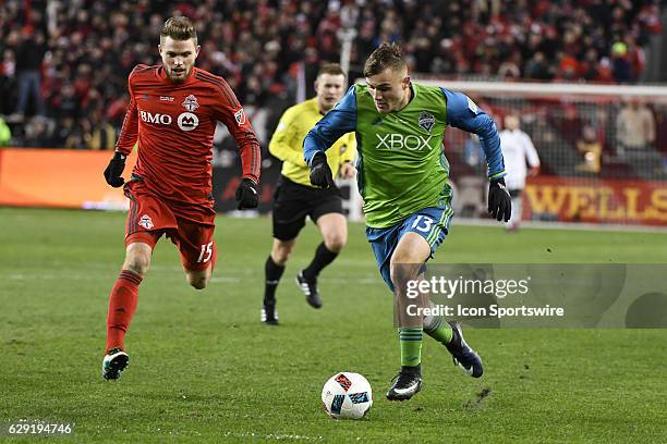 Toronto FC Defender Eriq Zavaleta and Seattle Sounders Forward Jordan Morris in action mduring the MLS Cup final game between the Seattle Sounders...