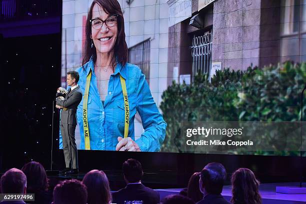 Neil Patrick Harris with a dog, speaks onstage during the CNN Heroes Gala 2016 at the American Museum of Natural History on December 11, 2016 in New...