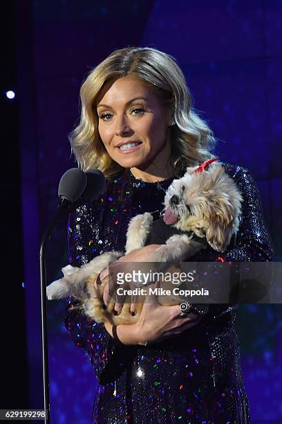 Host Kelly Ripa with a dog, speaks onstage during the CNN Heroes Gala 2016 at the American Museum of Natural History on December 11, 2016 in New York...