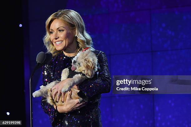 Host Kelly Ripa with a dog, speaks onstage during the CNN Heroes Gala 2016 at the American Museum of Natural History on December 11, 2016 in New York...