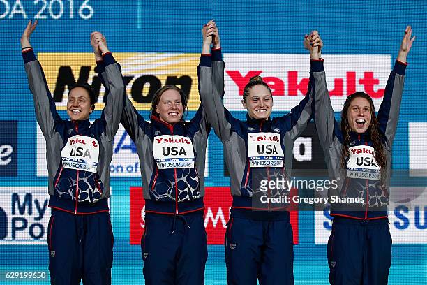 Team United States Alexandra DeLoof, Lilly King, Kali Worrell, and Mallory Comerford celebrate their gold medal in the 4x100m Medley Relay on day six...
