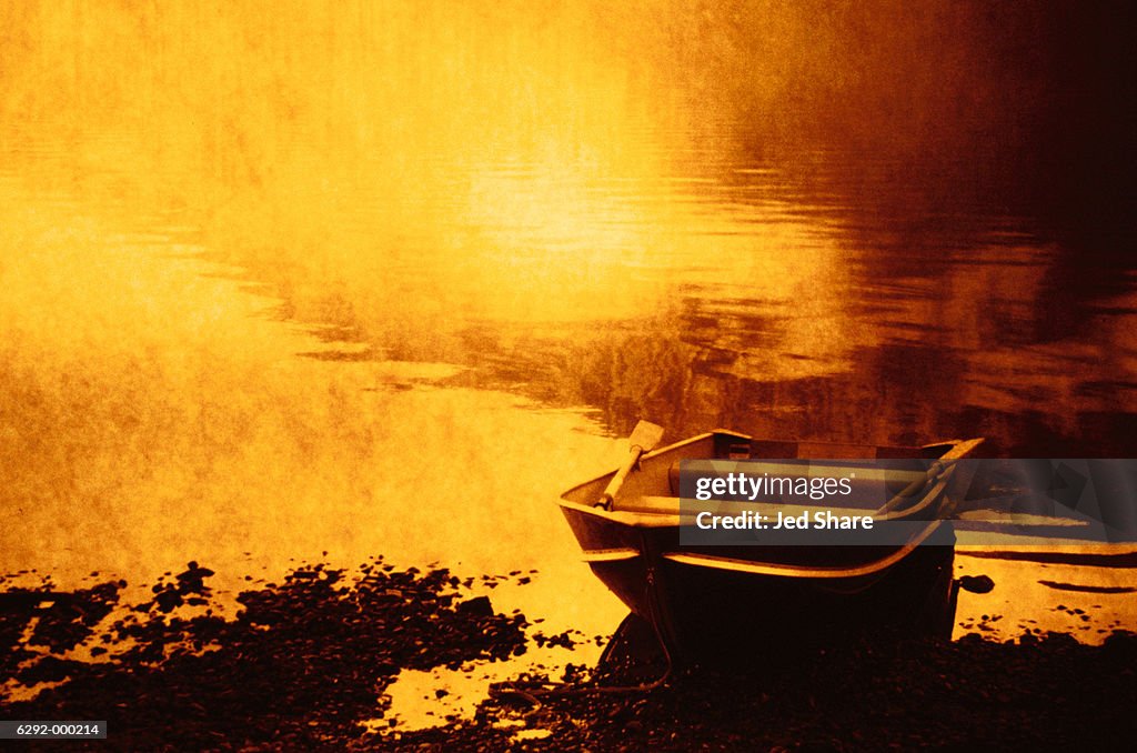 Rowboat at Edge of Lake