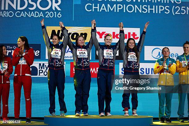 Team United States Alexandra DeLoof, Lilly King, Kali Worrell, and Mallory Comerford celebrate their gold medal in the 4x100m Medley Relay on day six...