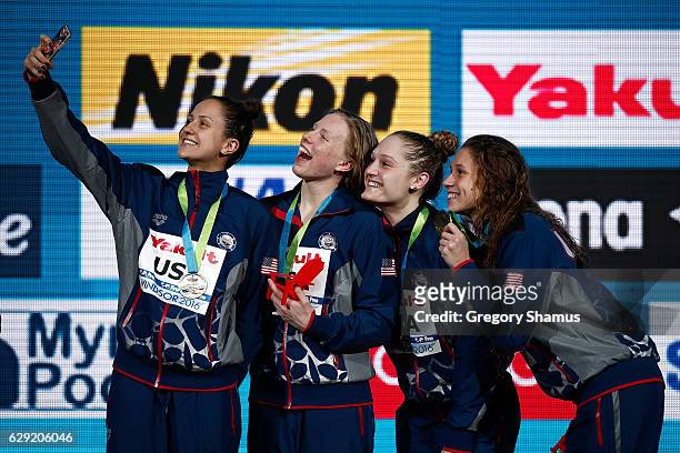 Team United States Alexandra DeLoof, Lilly King, Kali Worrell, and Mallory Comerford take a selfie after winning their gold medal in the 4x100m...