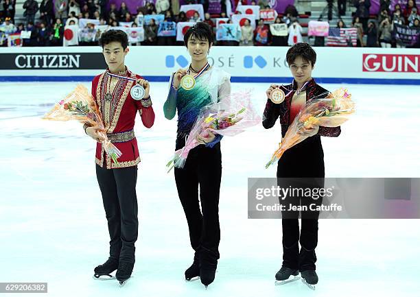 Silver medalist Nathan Chen of United States, gold medalist Yuzuru Hanyu of Japan, bronze medalist Shoma Uno of Japan pose during Senior Men's medal...