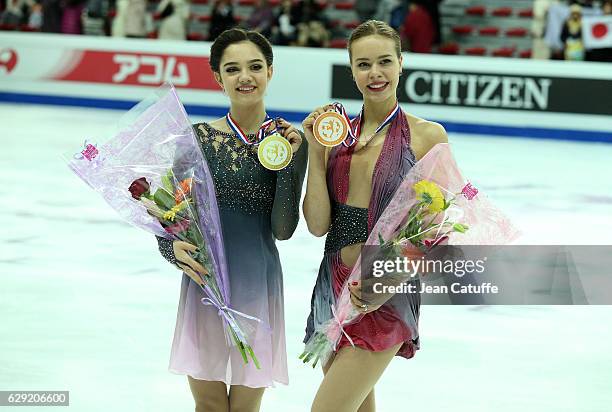 Gold medalist Evgenia Medvedeva of Russia, bronze medalist Anna Pogorilaya of Russia celebrate during Senior Ladies medal ceremony on day three of...