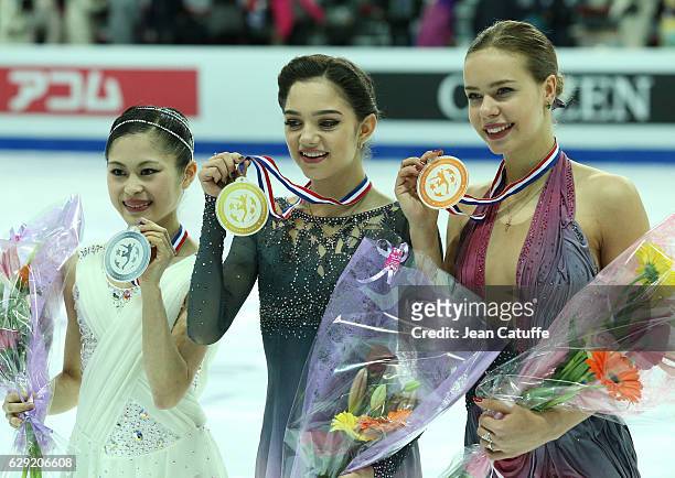 Silver medalist Satoko Miyahara of Japan, gold medalist Evgenia Medvedeva of Russia, bronze medalist Anna Pogorilaya of Russia pose during Senior...