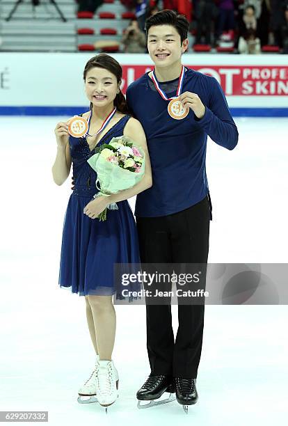 Bronze medalists Maia Shibutani and Alex Shibutani of USA pose during the medal ceremony for Senior Ice Dance on day three of the ISU Grand Prix of...