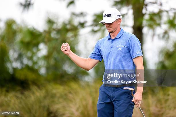 Jim Knous celebrates after making a birdie putt on the 17th hole green on the Crooked Cat Course during the final round of Web.com Tour Q-School at...