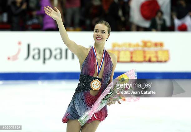 Bronze medalist Anna Pogorilaya of Russia celebrates during Senior Ladies medal ceremony on day three of the ISU Grand Prix of Figure Skating 2016 at...