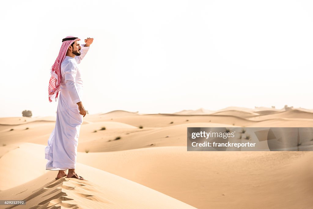 Arabic sheik on the desert look forward