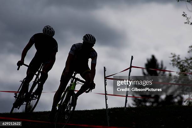 two cyclo-cross racers - cyclo cross stock pictures, royalty-free photos & images