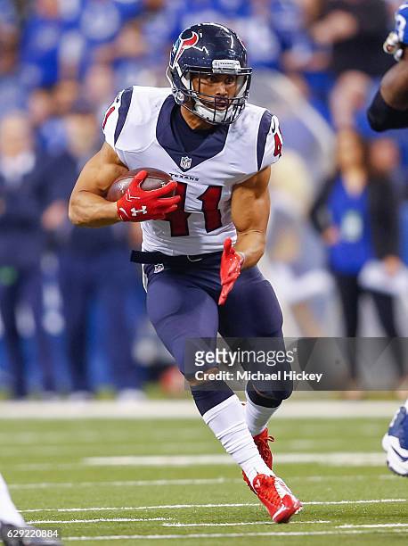 Jonathan Grimes of the Houston Texans runs the ball during the game against the Indianapolis Colts at Lucas Oil Stadium on December 11, 2016 in...