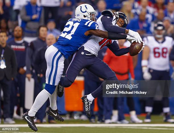 Vontae Davis of the Indianapolis Colts defends as DeAndre Hopkins of the Houston Texans attempts to make the reception at Lucas Oil Stadium on...