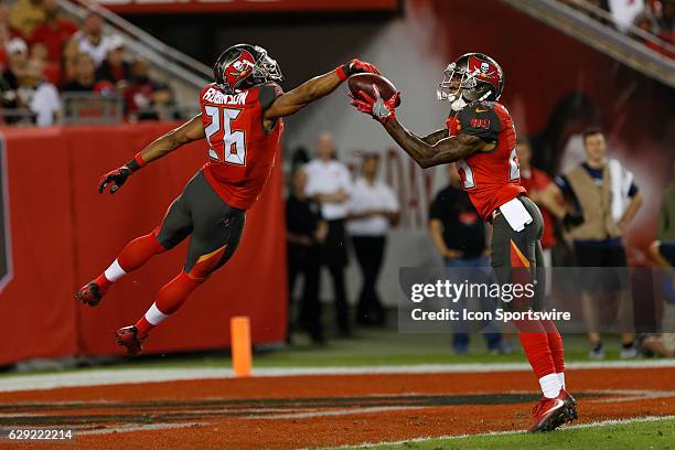Tampa Bay Buccaneers cornerback Ryan Smith and Tampa Bay Buccaneers defensive back Josh Robinson keep the ball out of the end zone during a punt that...