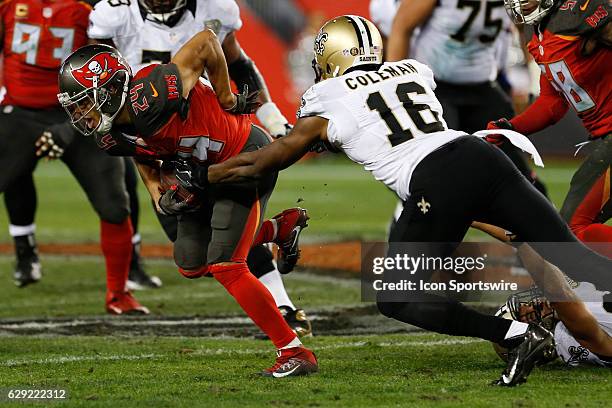 Tampa Bay Buccaneers cornerback Brent Grimes is tackled by New Orleans Saints wide receiver Brandon Coleman after intercepting a pass in the 4th...