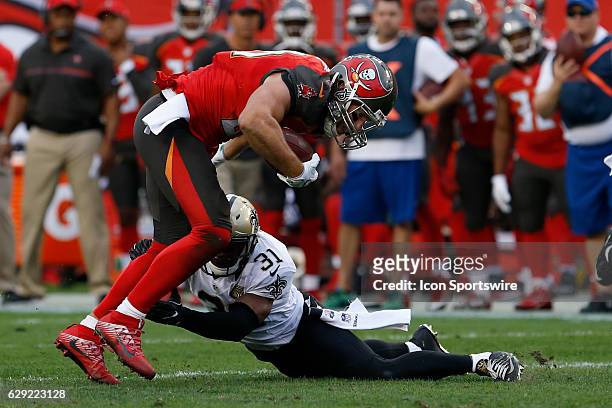 Tampa Bay Buccaneers tight end Cameron Brate is hit by New Orleans Saints free safety Jairus Byrd after catching a pass in the 1st quarter of the NFL...
