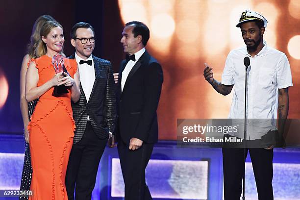 Actress Leslie Mann, actor Christian Slater and producer Tom Lassally look on as actor Keith Stanfield crashes the stage after Lassally walked...