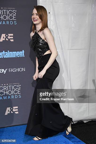 Actress Emma Stone poses in the press room during The 22nd Annual Critics' Choice Awards at Barker Hangar on December 11, 2016 in Santa Monica,...