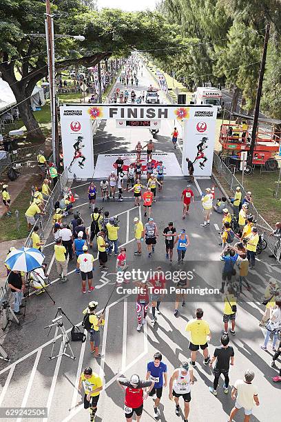 Participants are seen near the finish line during the Honolulu Marathon 2016 on December 11, 2016 in Honolulu, Hawaii.
