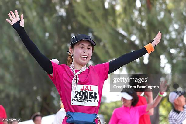 Participants are seen near the finish line during the Honolulu Marathon 2016 on December 11, 2016 in Honolulu, Hawaii.