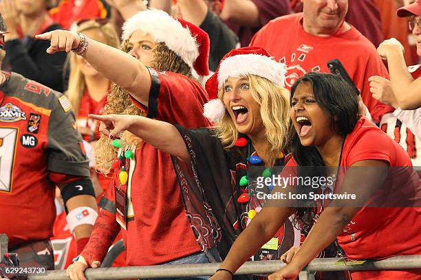 Lady fans of the Buccaneers show their emotions during the NFL Game between the New Orleans Saints and Tampa Bay Buccaneers on December 11 at Raymond...