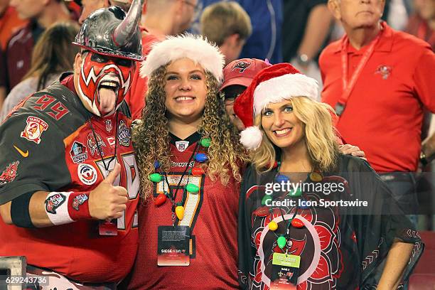 Pro Football Hall of Fame fan "Big Nasty" aka Keith Kunzig and his family pose together during the NFL Game between the New Orleans Saints and Tampa...