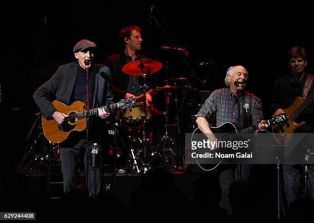 Headliner James Taylor and Jimmy Buffett perform at WCBS-FM 101.1's Holiday in Brooklyn concert at Barclays Center of Brooklyn on December 9, 2016 in...