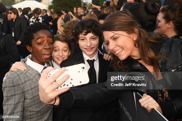 Actors Finn Wolfhard, Gaten Matarazzo, Noah Schnapp, and Caleb McLaughlin attend The 22nd Annual Critics' Choice Awards at Barker Hangar on December...