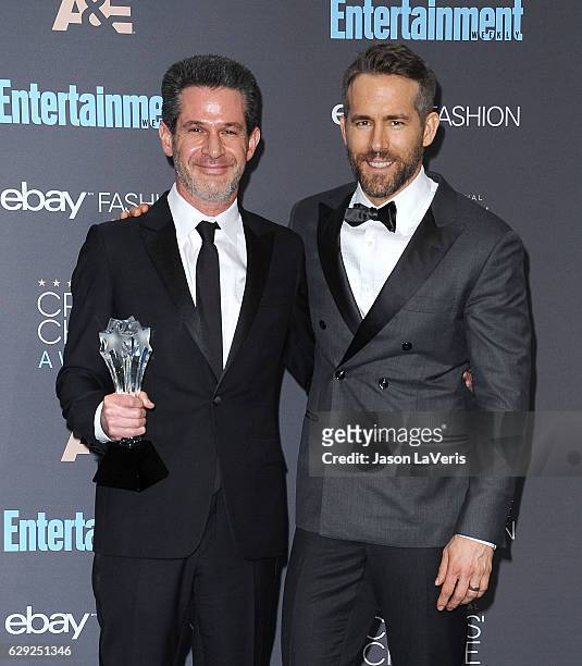 Producer Simon Kinberg and actor Ryan Reynolds pose in the press room at the 22nd annual Critics' Choice Awards at Barker Hangar on December 11, 2016...